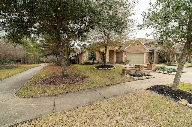 view of front of house featuring a garage and a front yard