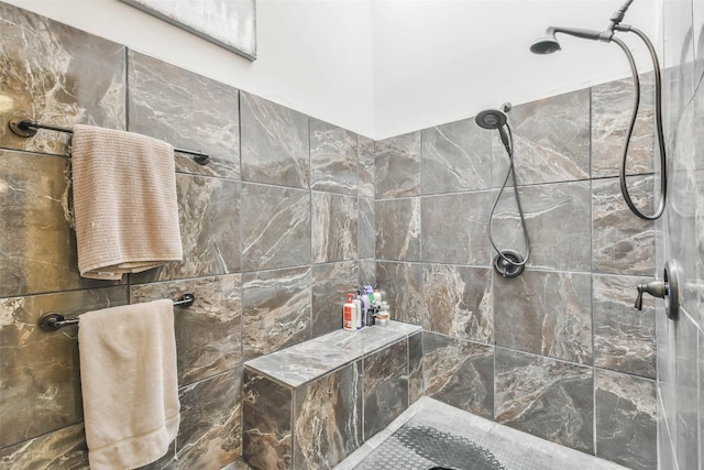 bathroom with tiled shower