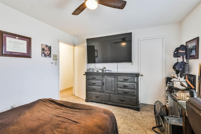 bedroom with light colored carpet and ceiling fan