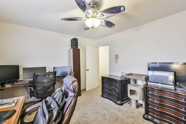 office featuring ceiling fan and light carpet