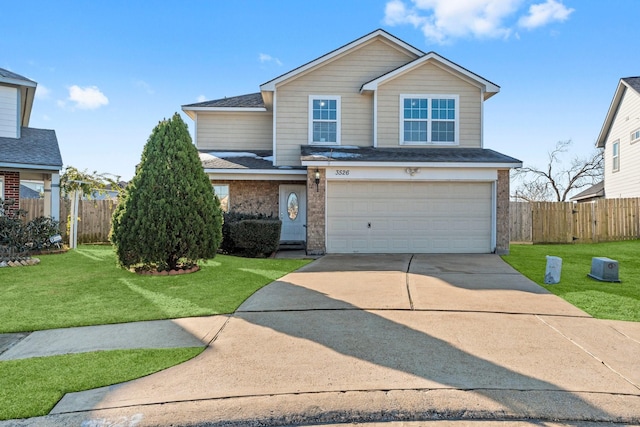 view of front property featuring a garage and a front yard