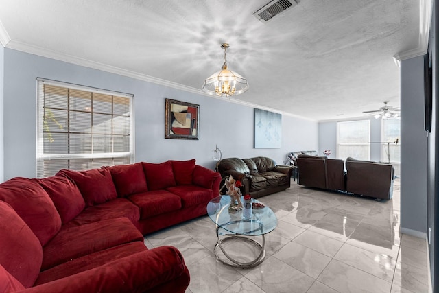 living room featuring crown molding, ceiling fan with notable chandelier, and a textured ceiling