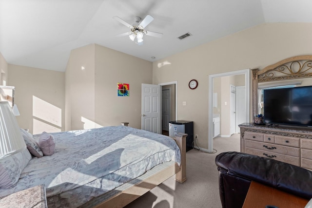 bedroom with ceiling fan, light colored carpet, and vaulted ceiling