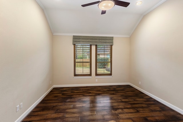 spare room with dark wood-type flooring, ceiling fan, ornamental molding, and vaulted ceiling