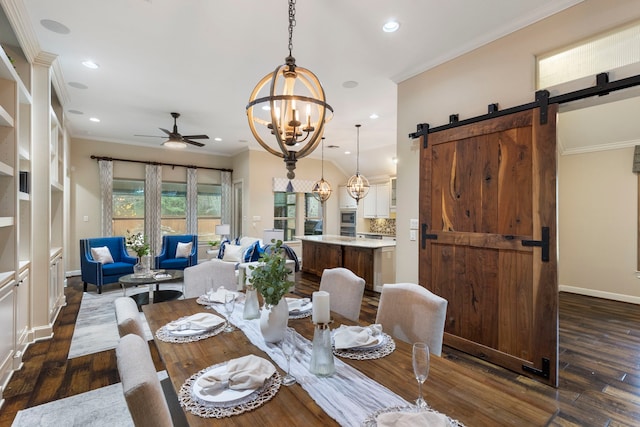 dining area with crown molding, a barn door, dark hardwood / wood-style flooring, and ceiling fan with notable chandelier