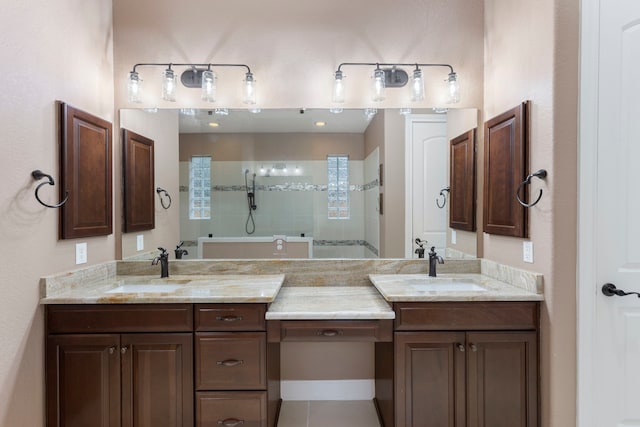 bathroom with vanity and a tile shower