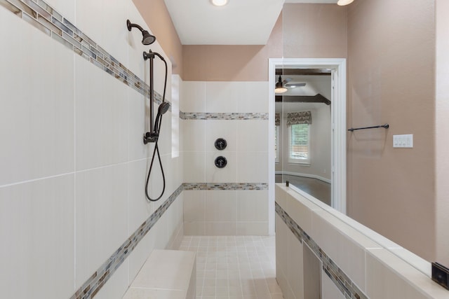 bathroom with tiled shower