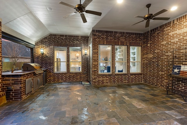 view of patio / terrace with sink, grilling area, ceiling fan, and an outdoor kitchen