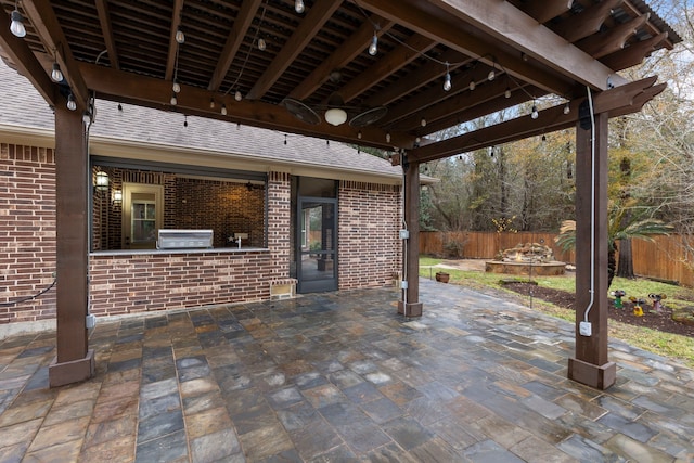 view of patio with area for grilling and exterior kitchen