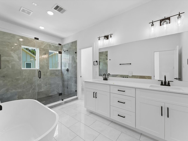 bathroom with vanity, tile patterned flooring, and plus walk in shower