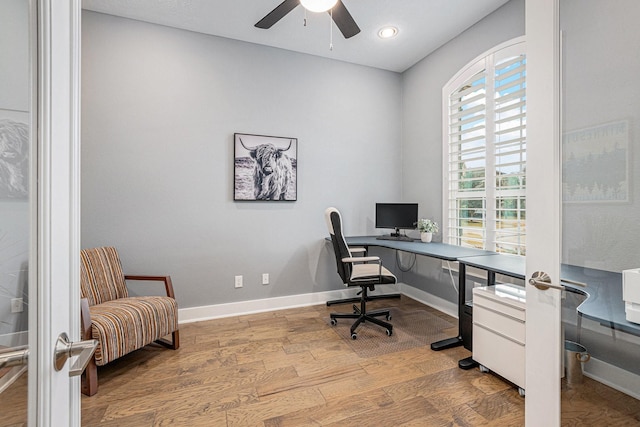 office space featuring ceiling fan and wood-type flooring