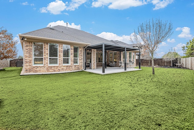 back of house with a yard and a patio area