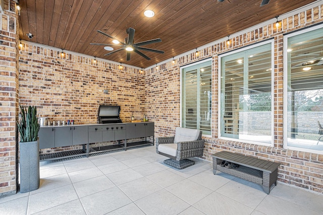 view of patio featuring ceiling fan