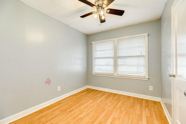 unfurnished room featuring ceiling fan and light wood-type flooring