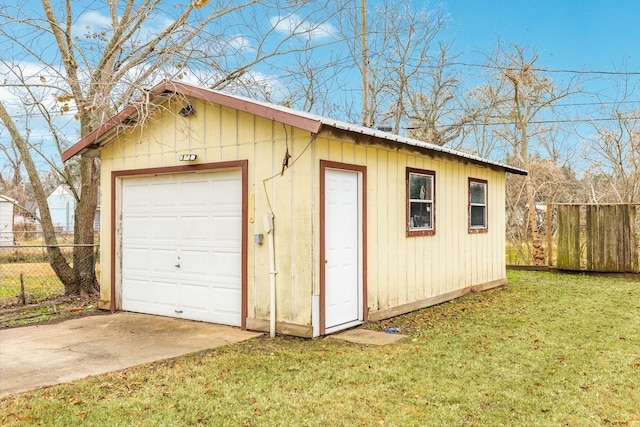 garage with a lawn