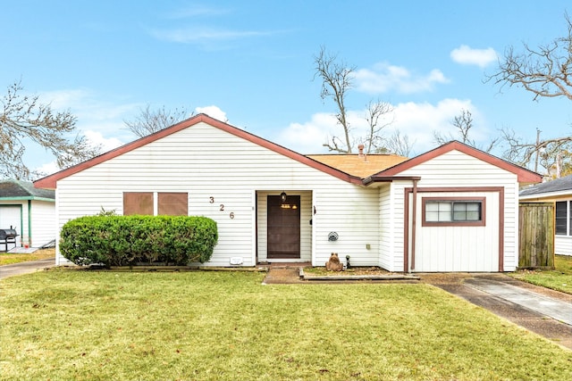 view of front of property with a front lawn