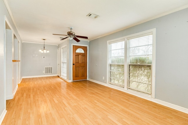 foyer entrance featuring crown molding, ceiling fan with notable chandelier, and light hardwood / wood-style flooring