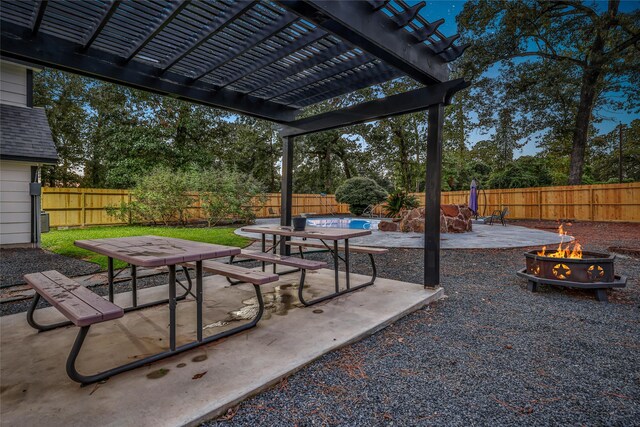 view of patio with a pergola, a fenced in pool, and a fire pit