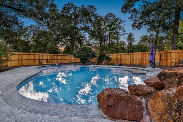 view of pool featuring a patio and a diving board