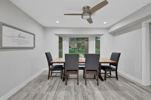 dining room featuring light hardwood / wood-style flooring and ceiling fan