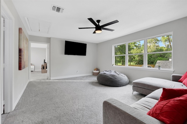 carpeted living room featuring ceiling fan