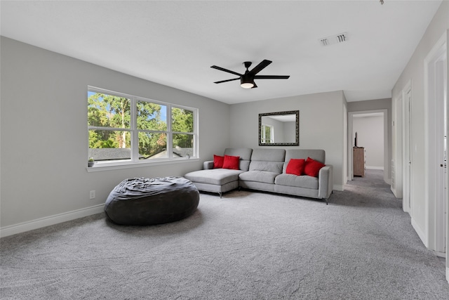 carpeted living room featuring ceiling fan