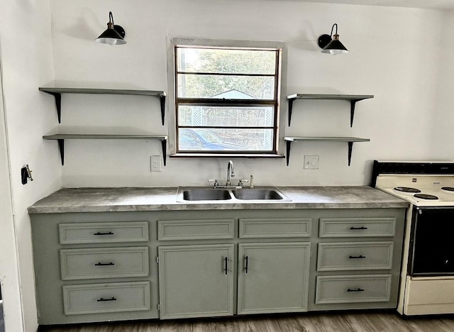 kitchen featuring sink, white electric stove, and light hardwood / wood-style floors