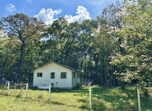 view of home's exterior featuring a yard