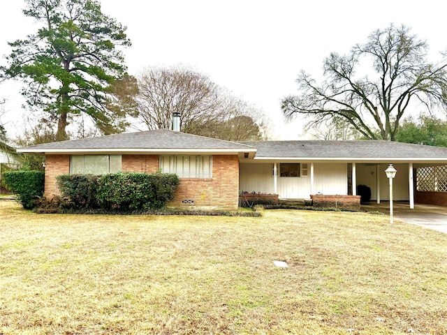 single story home featuring a carport and a front yard