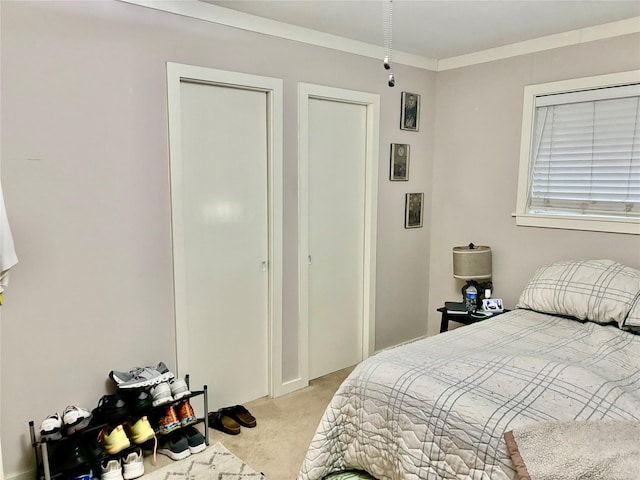 bedroom featuring light colored carpet