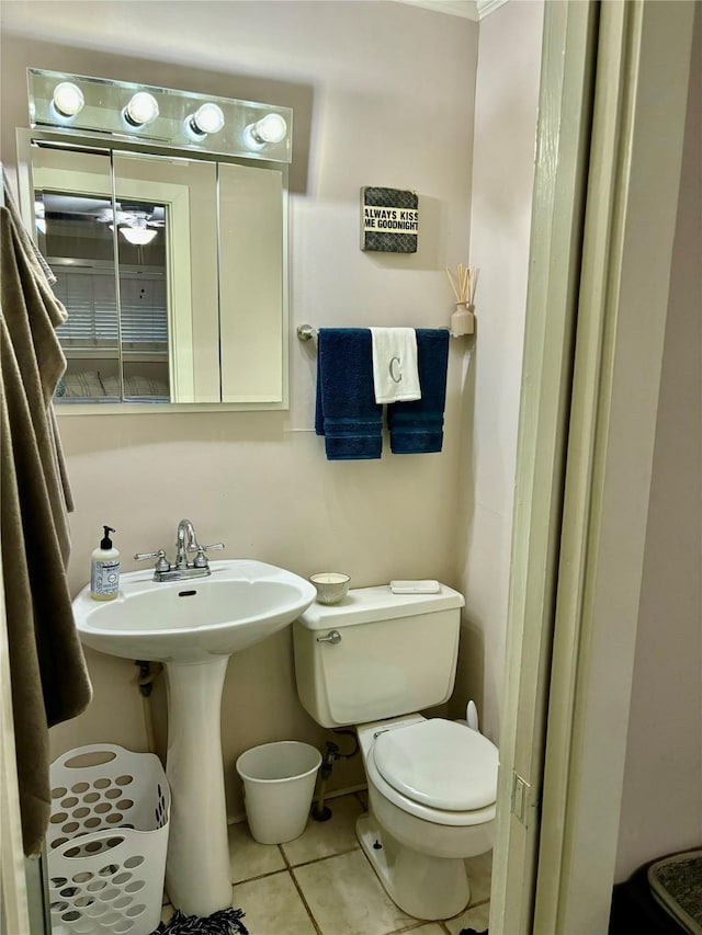 bathroom with tile patterned flooring, sink, and toilet