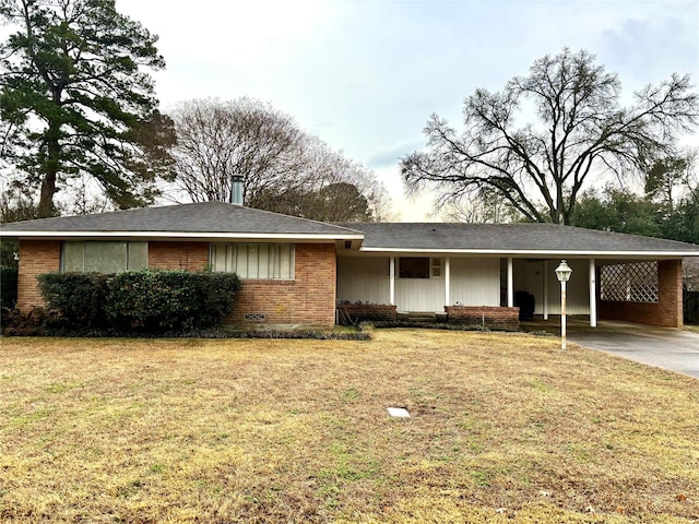 ranch-style home with a front lawn and a carport