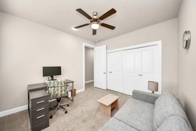 office area with ceiling fan and light colored carpet