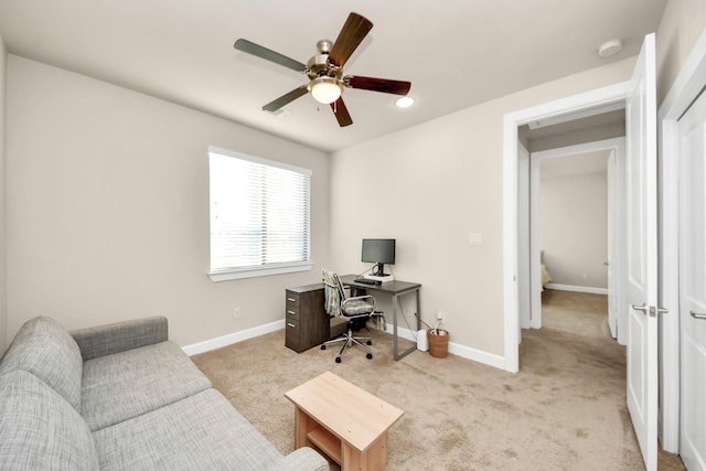 office with light colored carpet and ceiling fan