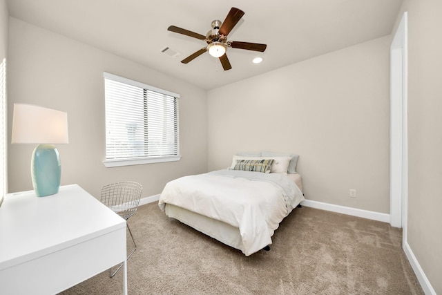 bedroom featuring ceiling fan and light carpet