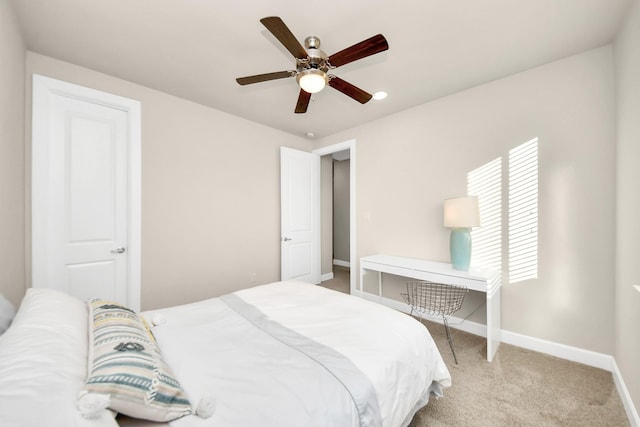 carpeted bedroom with ceiling fan