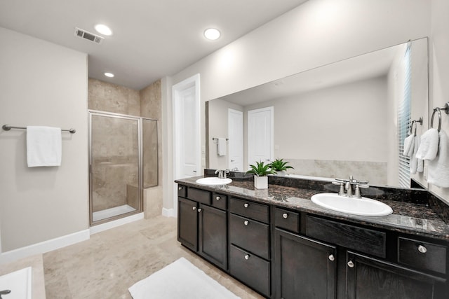 bathroom with vanity and walk in shower