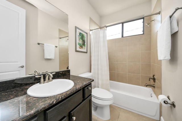 full bathroom with vanity, toilet, tile patterned flooring, and shower / bath combo