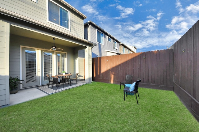 view of yard featuring ceiling fan and a patio area