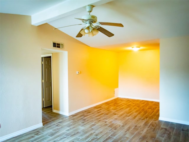 unfurnished room featuring hardwood / wood-style flooring, vaulted ceiling with beams, and ceiling fan