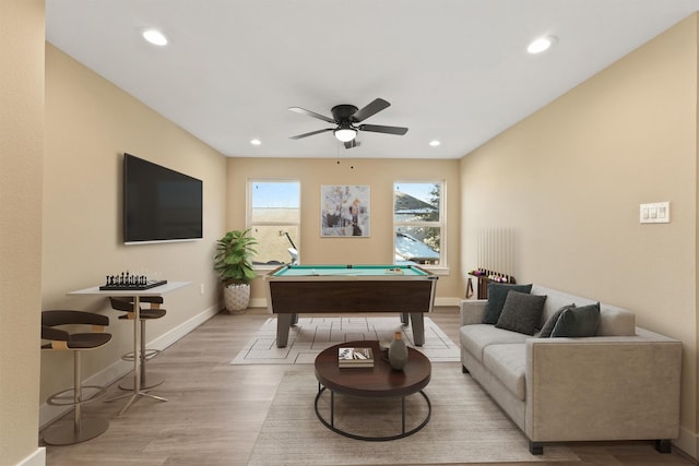 rec room with ceiling fan, billiards, and light hardwood / wood-style flooring