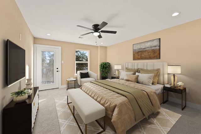 bedroom featuring access to outside, light colored carpet, and ceiling fan