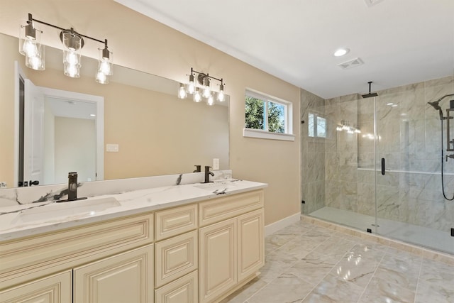 bathroom featuring vanity and a shower with door