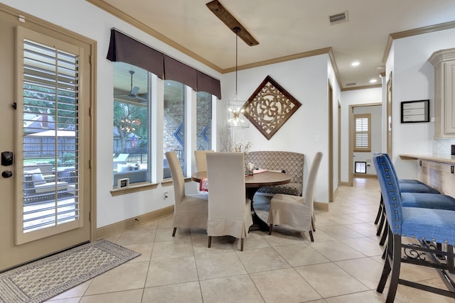 17715 Lakeside Haven Dr, Cypress, TX 77433 - dining space featuring crown molding, light tile patterned flooring, and baseboards