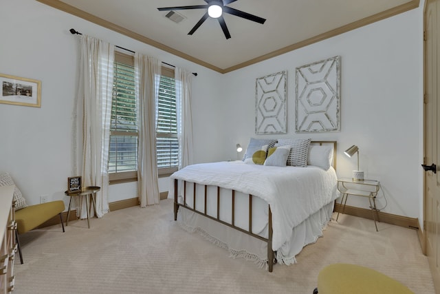 bedroom featuring baseboards, light colored carpet, visible vents, and crown molding