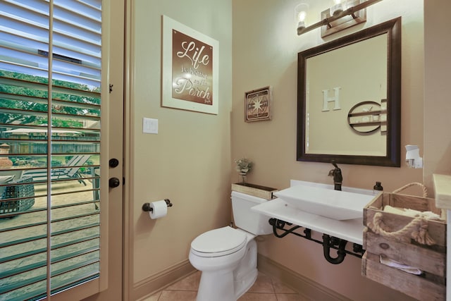 17715 Lakeside Haven Dr, Cypress, TX 77433 - bathroom with tile patterned flooring, toilet, and baseboards