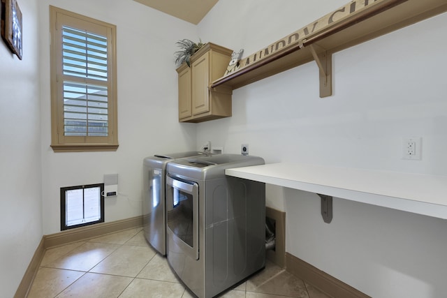17715 Lakeside Haven Dr, Cypress, TX 77433 - laundry room featuring cabinet space, independent washer and dryer, baseboards, and light tile patterned floors