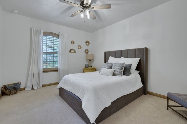 17715 Lakeside Haven Dr, Cypress, TX 77433 - carpeted bedroom featuring baseboards and ceiling fan