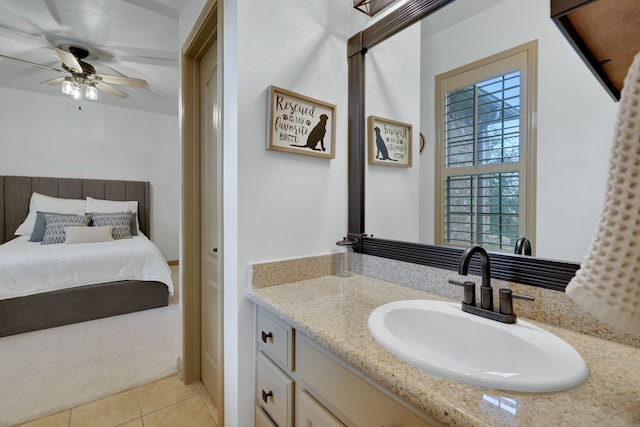 bathroom with a ceiling fan, tile patterned flooring, and vanity