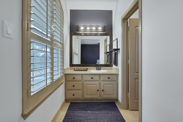 17715 Lakeside Haven Dr, Cypress, TX 77433 - bathroom with vanity, tile patterned flooring, and baseboards